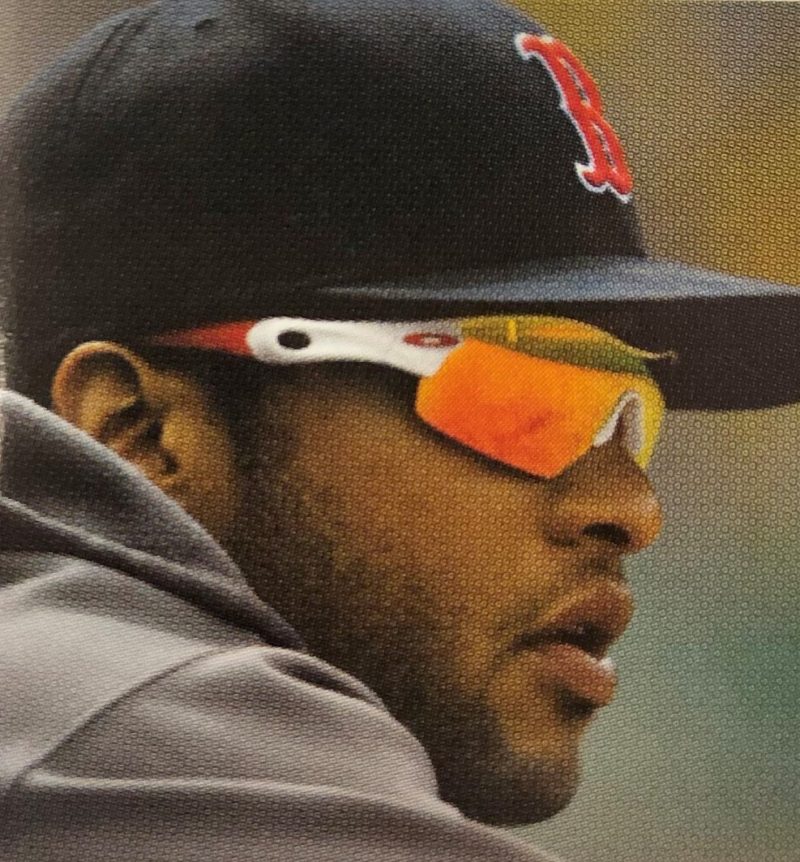 Darnell McDonald a man wearing a hat and glasses