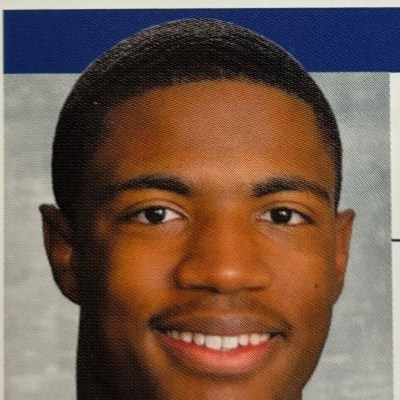a person posing for the camera with Old Tuscaloosa County Jail in the background