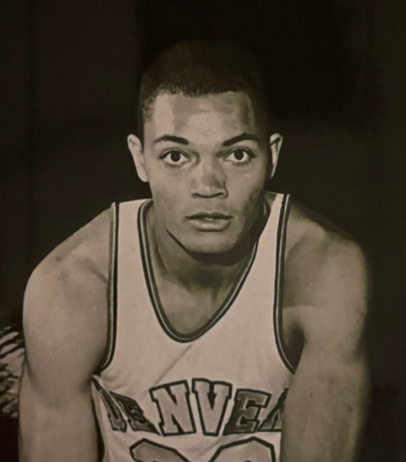 Black and white photo of a basketball player in a Denver jersey.